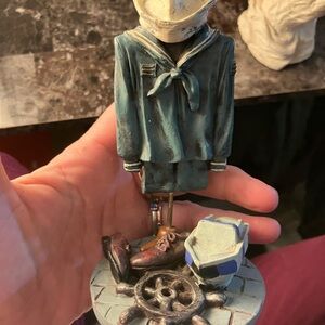 Blue and Brown Sailor Sculpture Art
